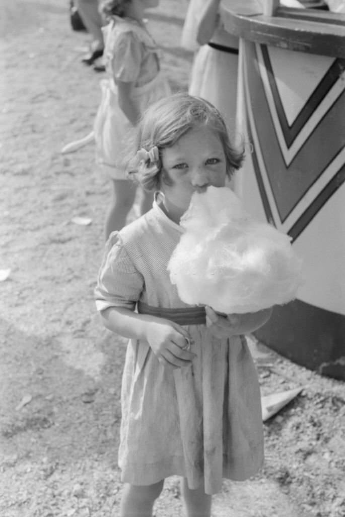 Young Girl Eating Cotton Candy, Cotton Carnival, Memphis, Tennessee, May 1940