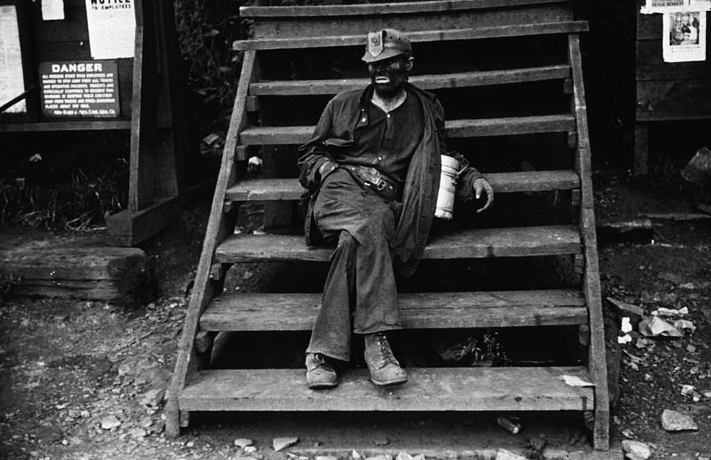 A coal miner, waiting for a lift home, in Caples, West Virginia, 1939