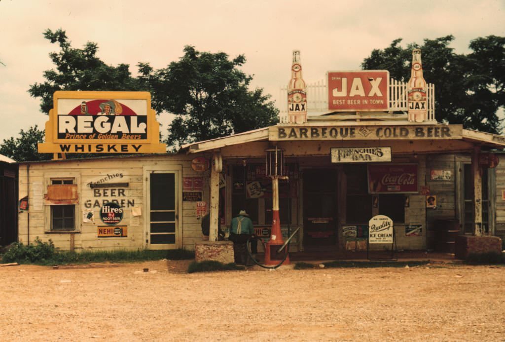 A cross roads store, bar, "juke joint," and gas station in the cotton plantation area, Melrose, Louisiana., 1940