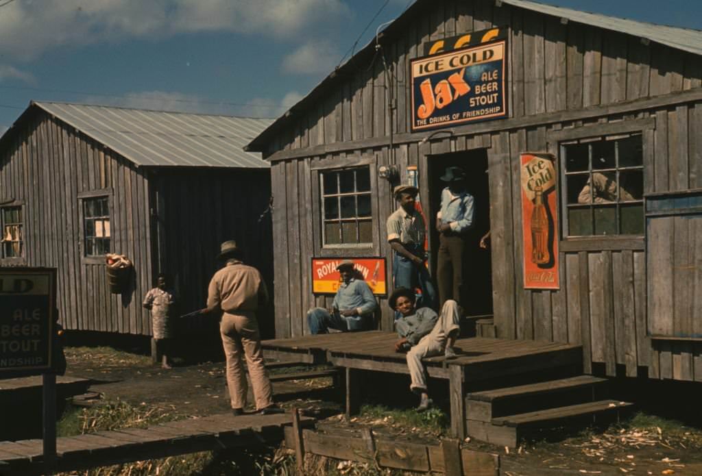 Living quarters and "juke joint" for migratory workers, a slack season; Belle Glade, Florida, 1939