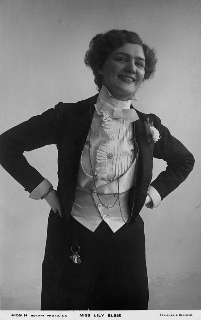 Musical stage actress Lily Elsie, dressed in men's formal clothing, 1910