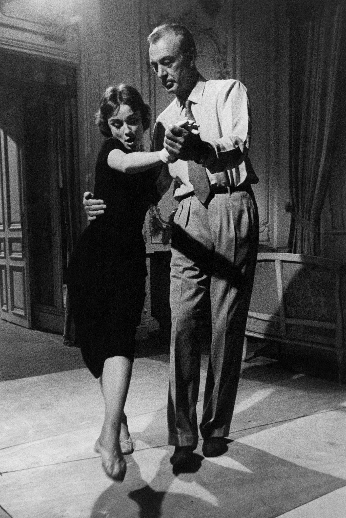 Audrey Hepburn dances with Gary Cooper during the filming of "Love in the Afternoon" in Paris, France.