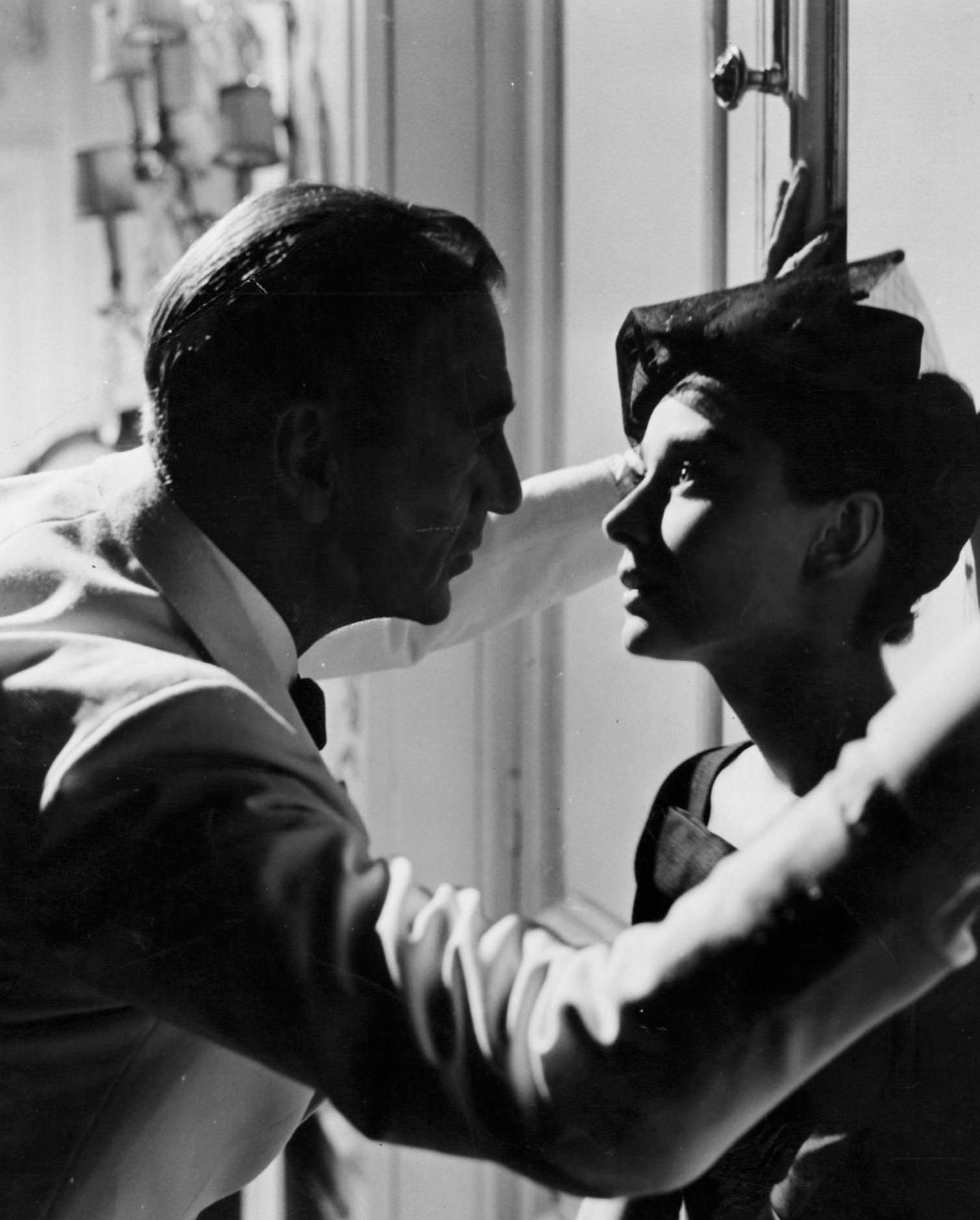 Gary Cooper faces Audrey Hepburn in a scene from the film 'Love In The Afternoon', 1957.