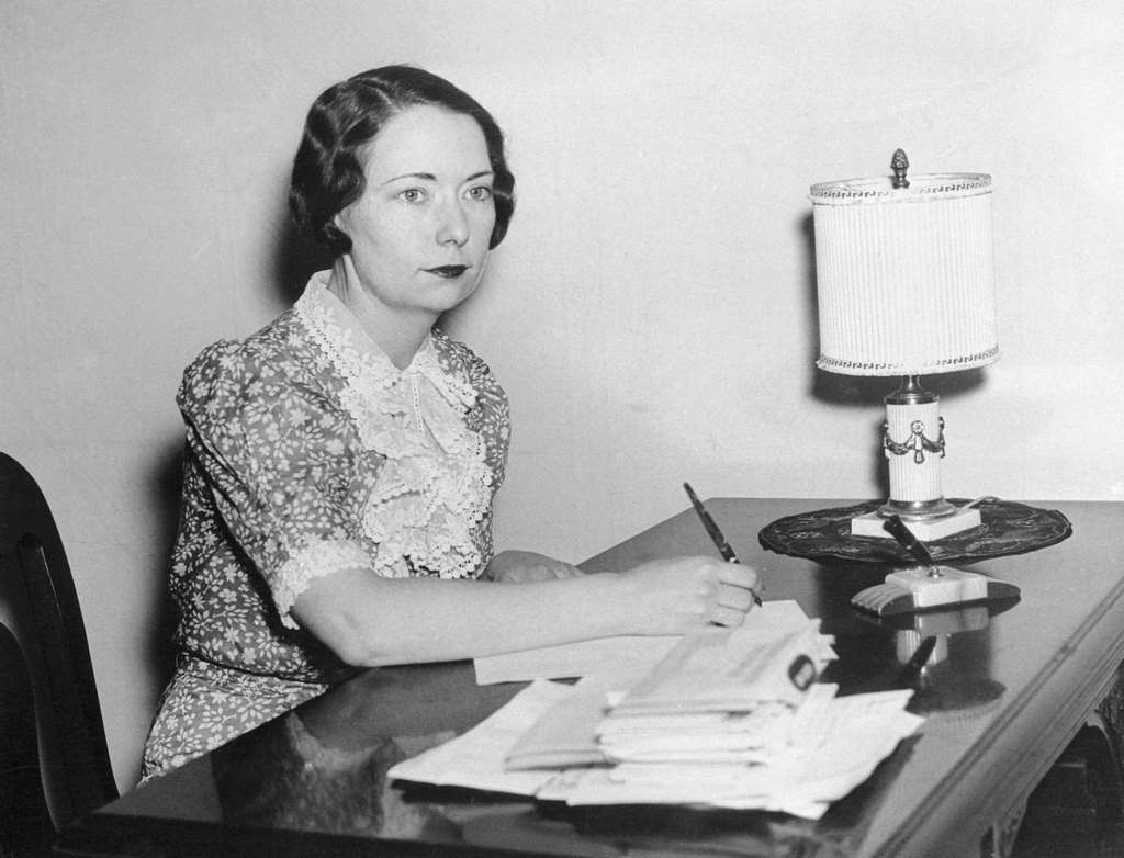 Novelist Margaret Mitchell sits at her desk at home in Georgia following the announcement that her novel Gone with the Wind had won the Pulitzer Prize.
