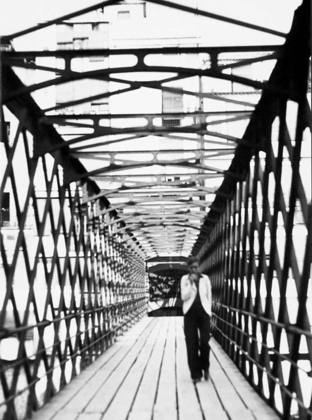 Annemarie Schwarzenbach crossing the Eiffel Bridge over the Onyar river, Girona, 1933