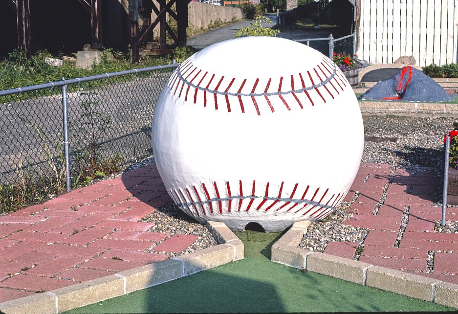 Giant baseball hole, Salute to the USA mini golf, Lake Winnipesaukee Pier, Weirs Beach, New Hampshire, 1981