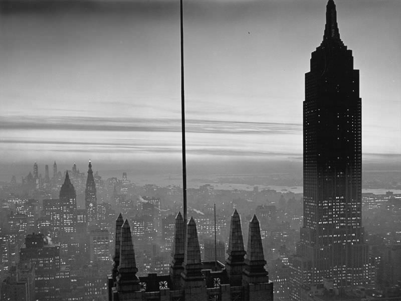 Midtown Manhattan and Empire State building at dusk, New York City, circa 1930s