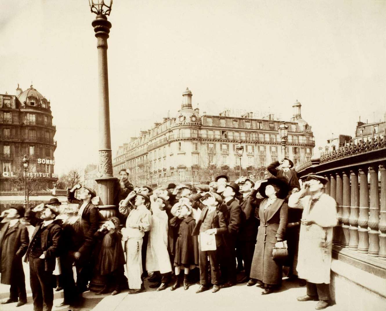 Eugene Atget Solar eclipse of April 17, 1912. Parisians watching the phenomenon from the Place de la Bastille.