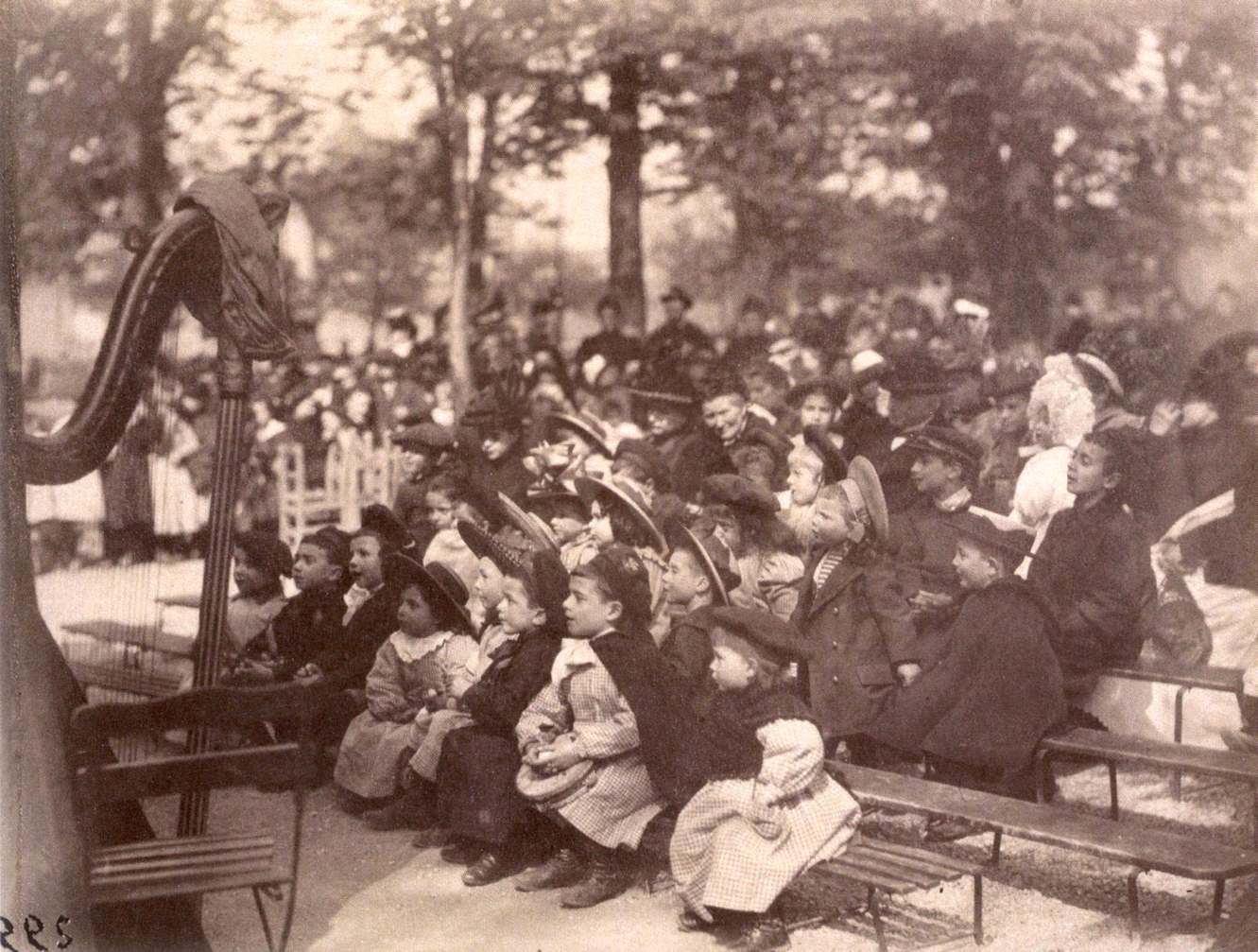 Children during a Guignol show in the Luxembourg gardens in Paris, 1899