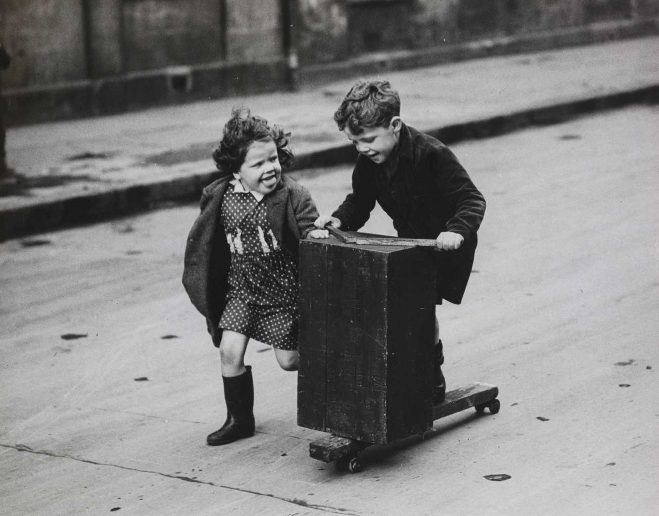 Brother and Sister Make the Roadway a Playground Outside Their Home in Hospital Street, Gorbals, 1950