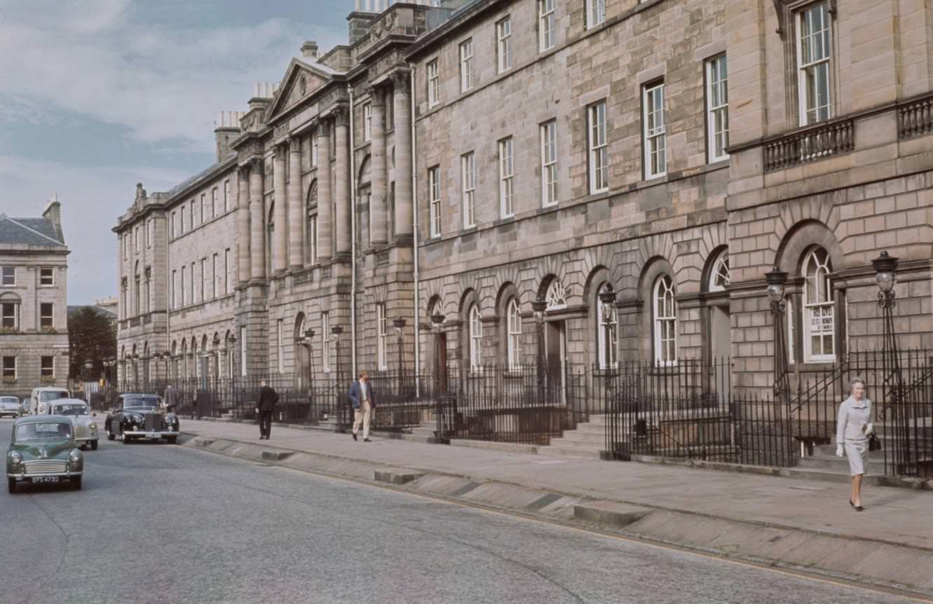 Cars and pedestrians make their way around Charlotte Square, a Georgian garden square in the New Town area of Edinburgh, Scotland, 1965.