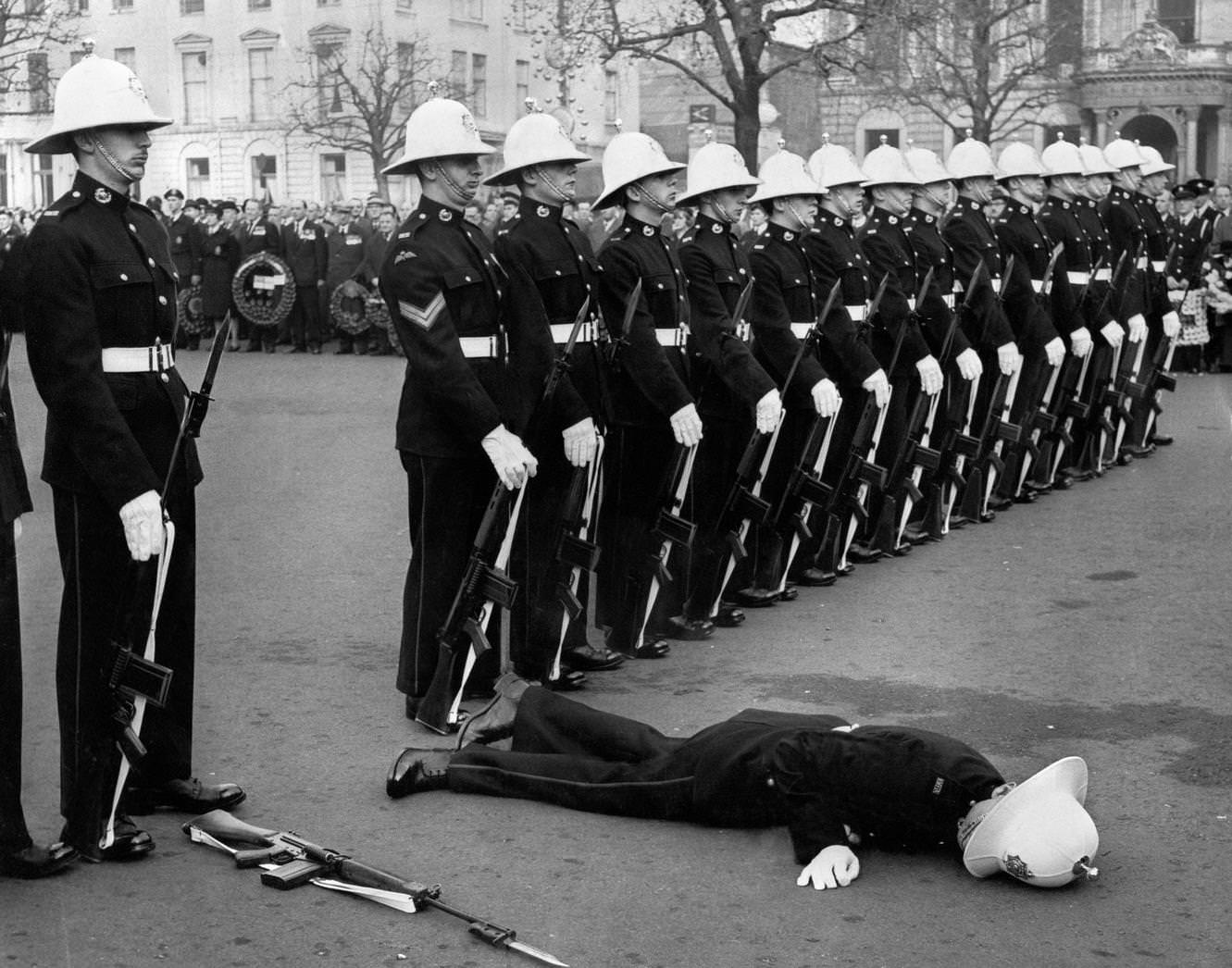 Marine fainting in George Square, Glasgow, when the Royal Marines provided a guard of honour for Remembrance Day service the Cenotaph, 1964