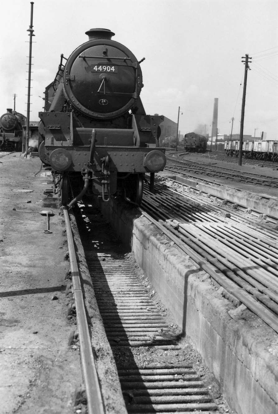 Class 5 locomotive over the ashpit at Polmadie depot, Glasgow, 1962.