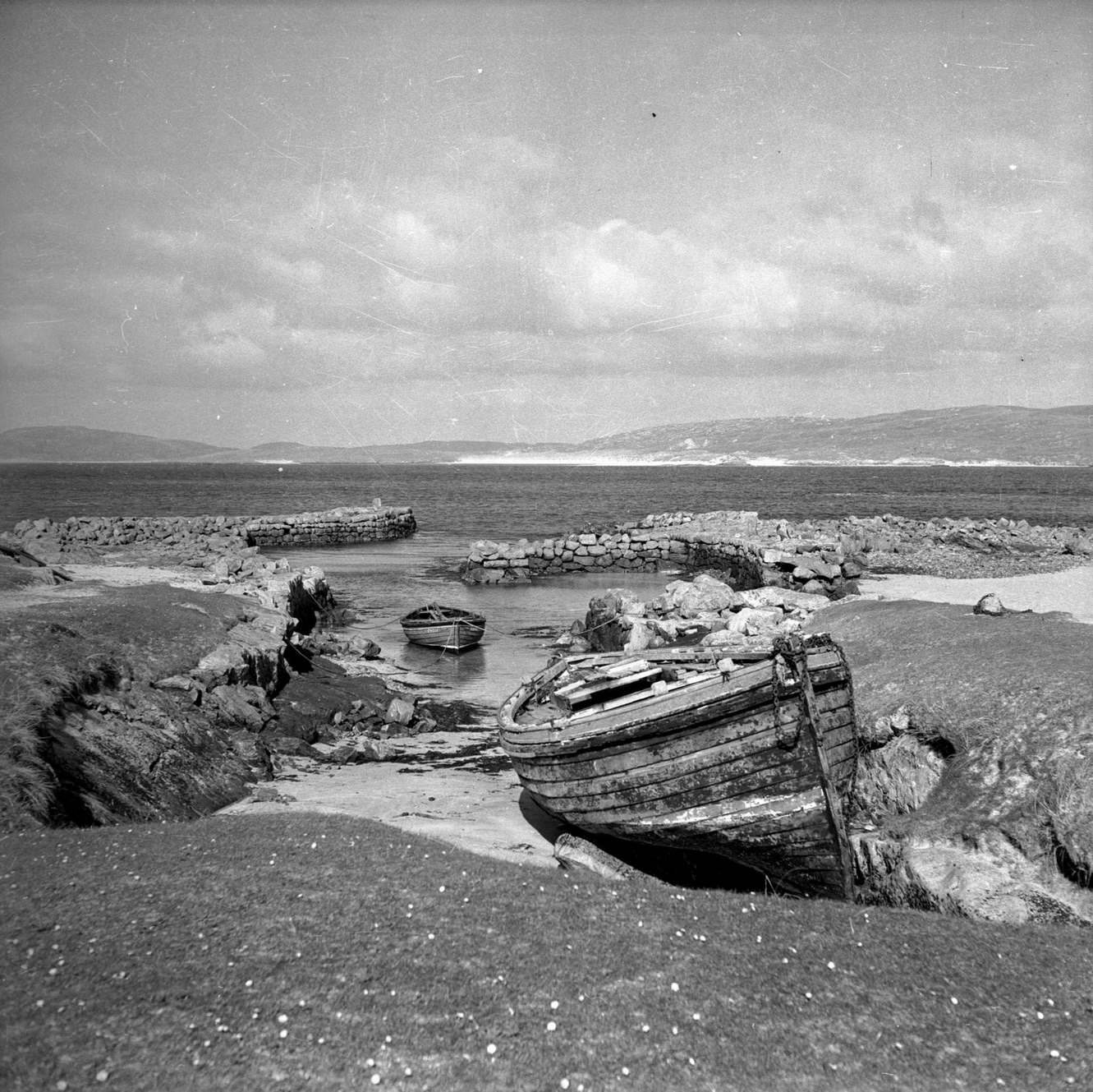 Boats at Eoligarry Jetty on North Bay on the island of Barra in the Outer Hebrides, 1960