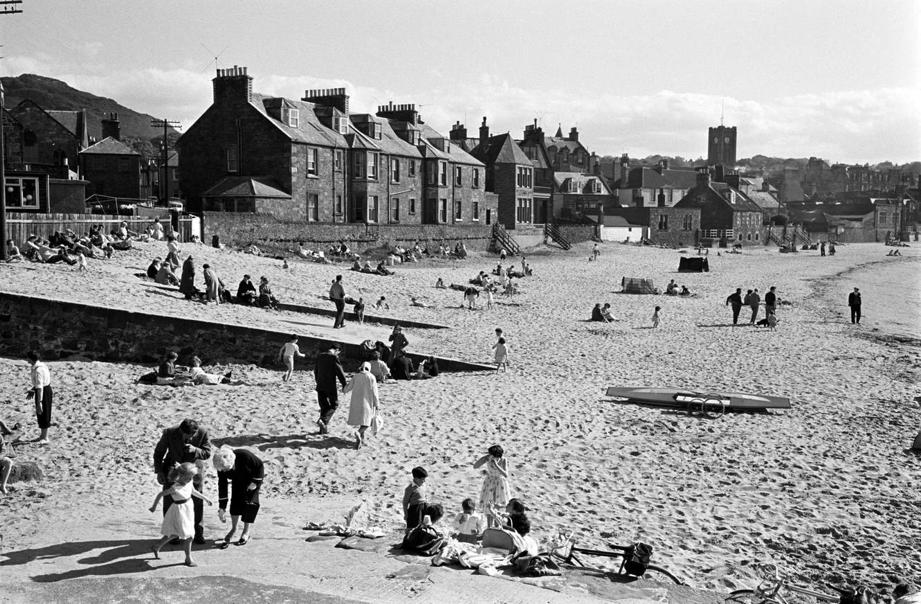 Scottish people relaxing on the beach. Musselburgh, 1960s