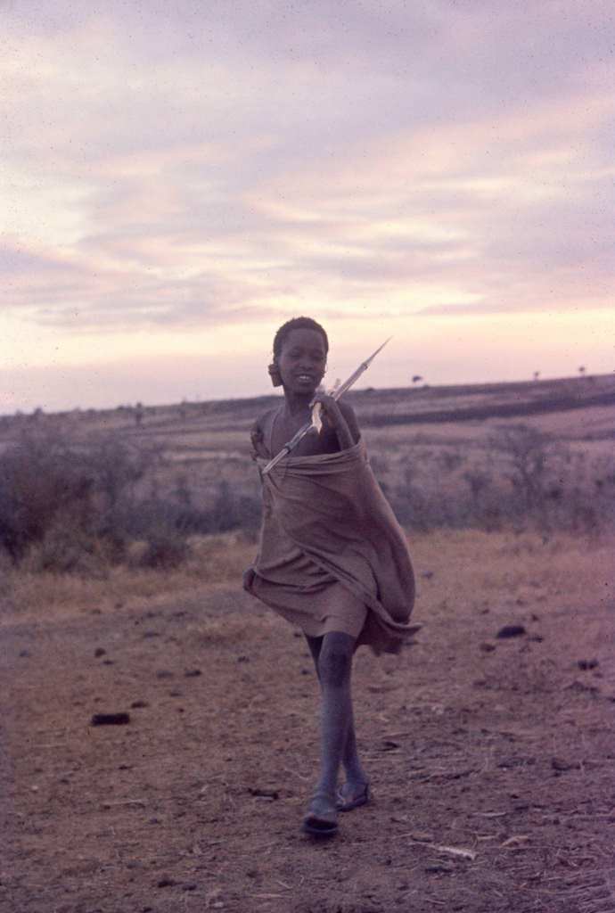 A shepherd as he holds a spear, Tanzania, 1962.