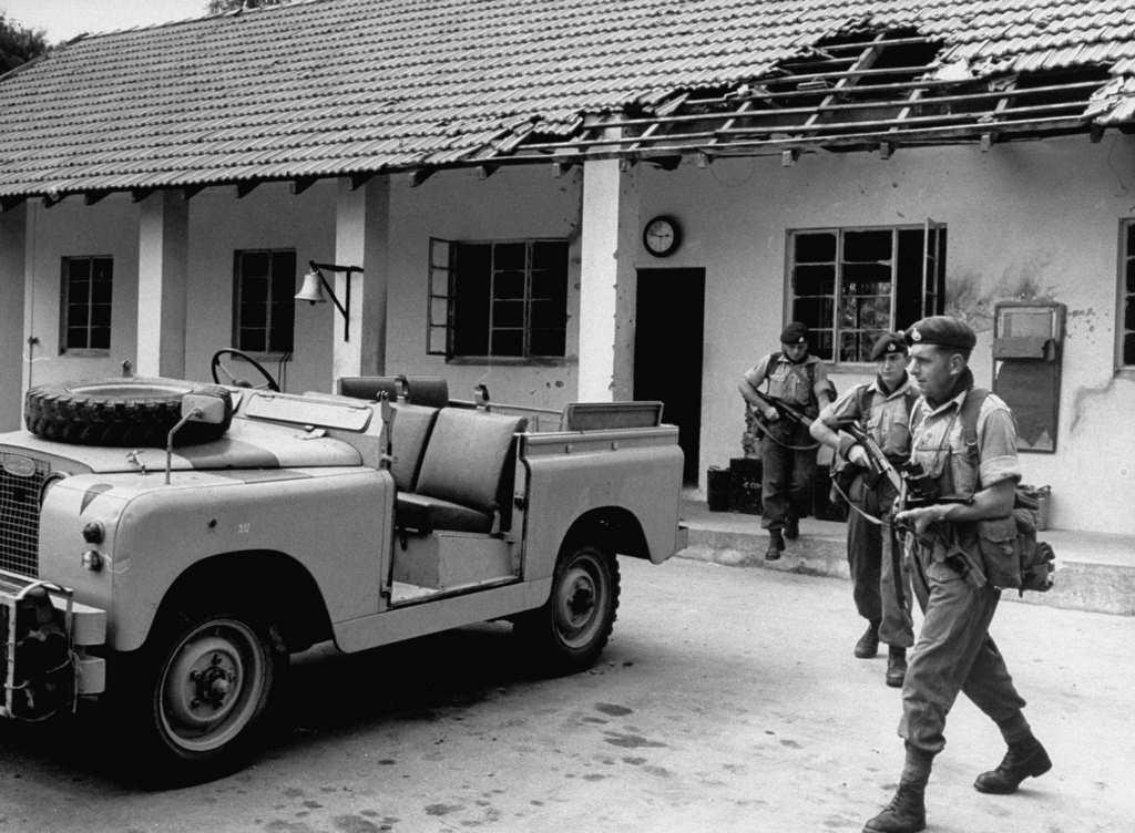 Members of the British Royal Marines (possibly 45 Commando Royal Marines) clear out the armory at Colito Barracks in Dar es Salaam, 1960s