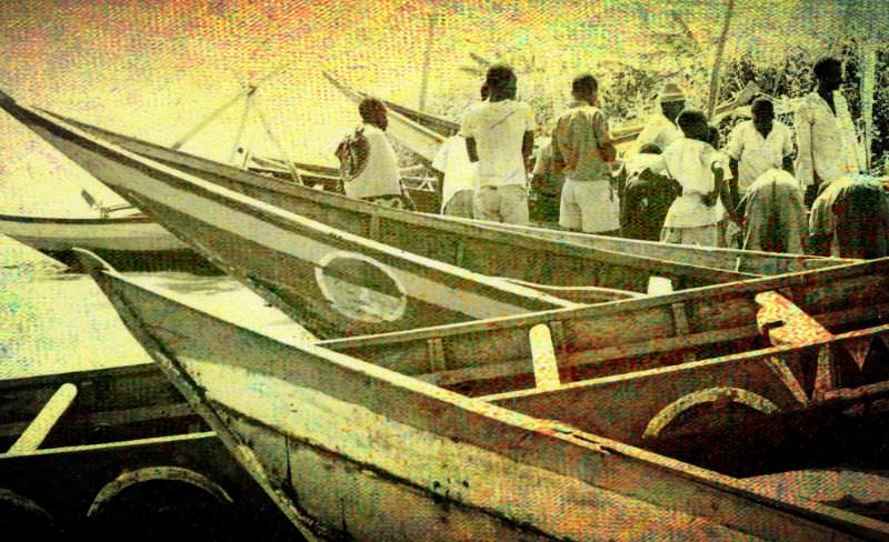 A typical scene–boats have landed with fish for sale from the beach, 1969