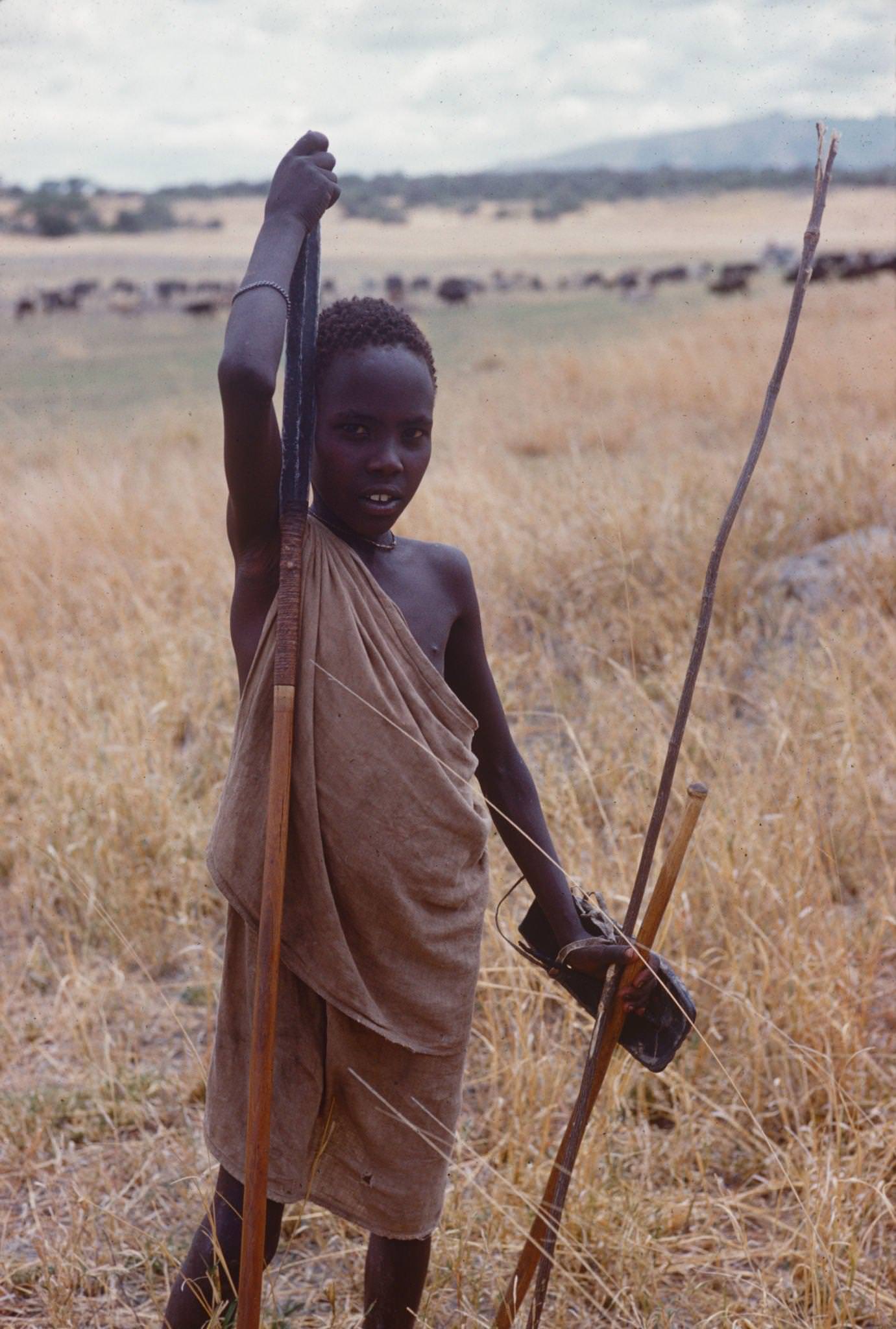 A shepherd as he holds a spear, Tanzania, 1962.