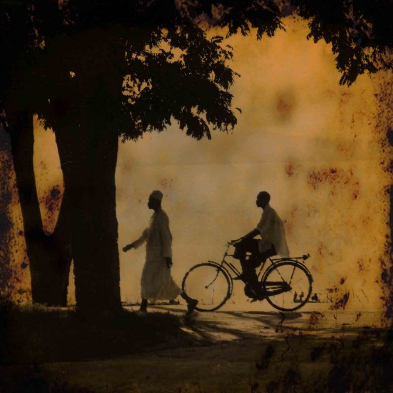 Two men traveling along the shore of Lake Victoria in Mwanza, Tanzania, 1969