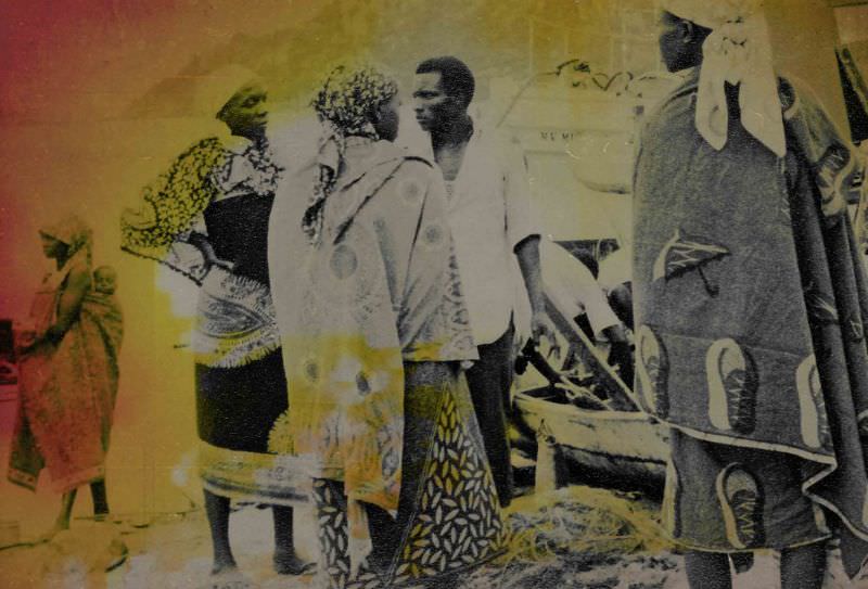 Women in Kitenge (or Kanga are wrap garments from East Africa, sold in matching pairs) on a Lake Victoria fishing beach in Tanzania, 1969