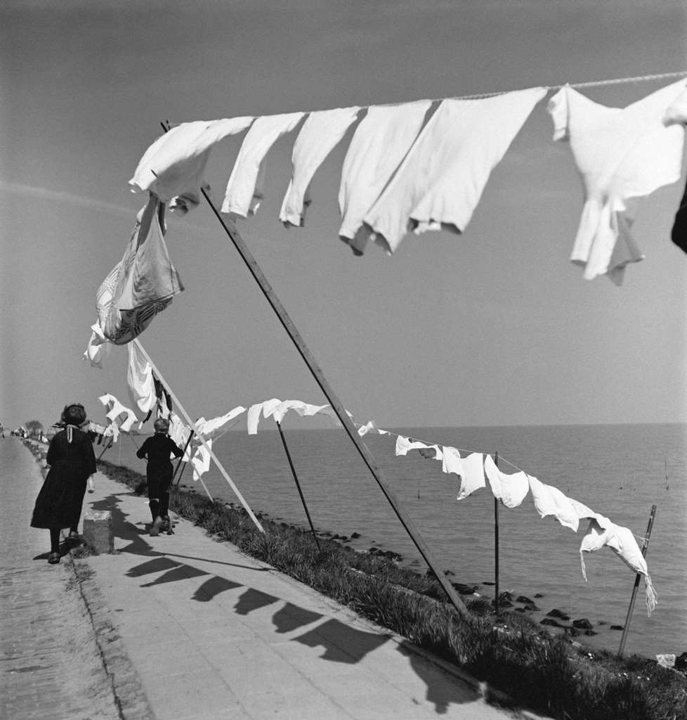 Laundry drying on the wires by the sea, 1960