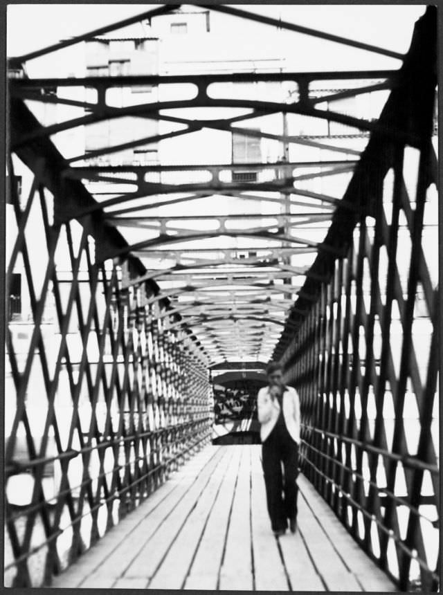 Annemarie Schwarzenbach crossing the Eiffel Bridge over the Onyar river, Girona, 1933