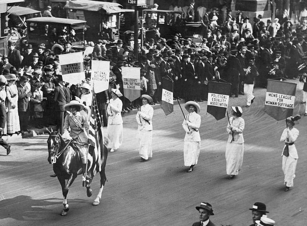 Grand Marshal Inez Milholland Boissevain leads a parade of 30,000 representives of the various Women's Suffrage associations, 1913