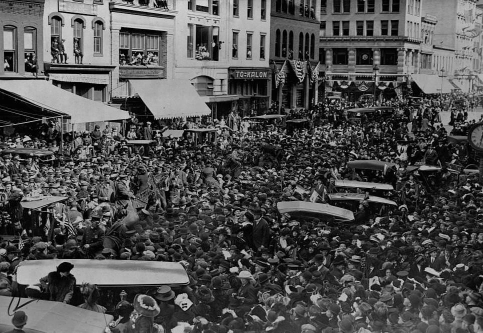Crowds fill a street in Washington D.C. during a suffrage parade in 1913.