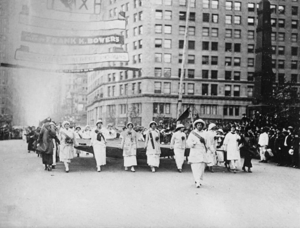 Suffragettes matching at a parade, 1913