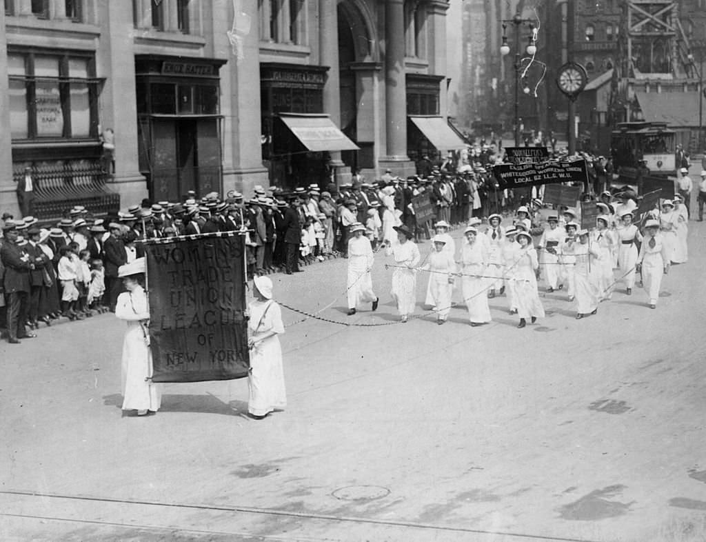 Suffragettes carrying the banner of the Women's Trade Union League of New York on a Labour Day Parade.