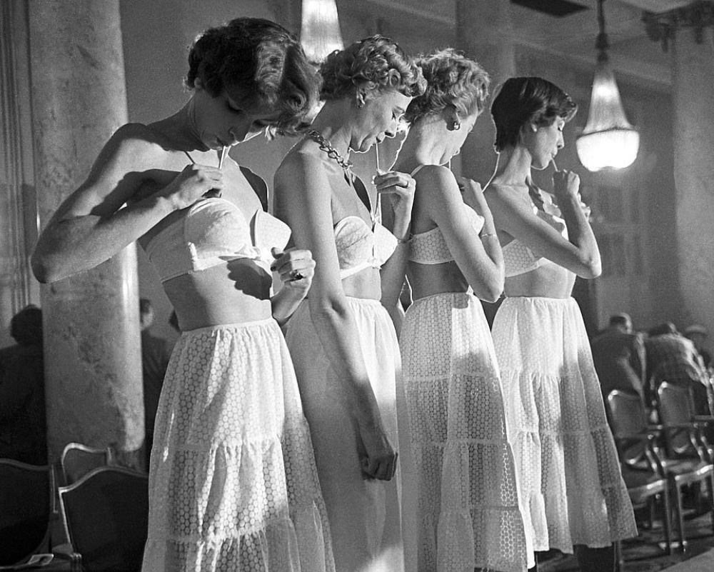 Four models show how to use the Trés Secrete bra, developed by La Resista Corset Co. in Connecticut.