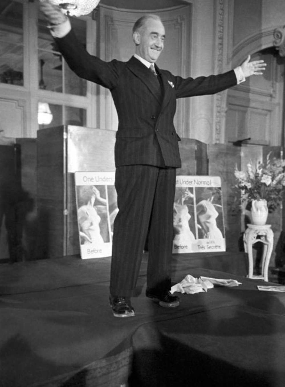 A gentleman, who is believed to have work for the lingerie company, is seen taking to the stage to promote the product, with the adverts for the bra seen behind him.
