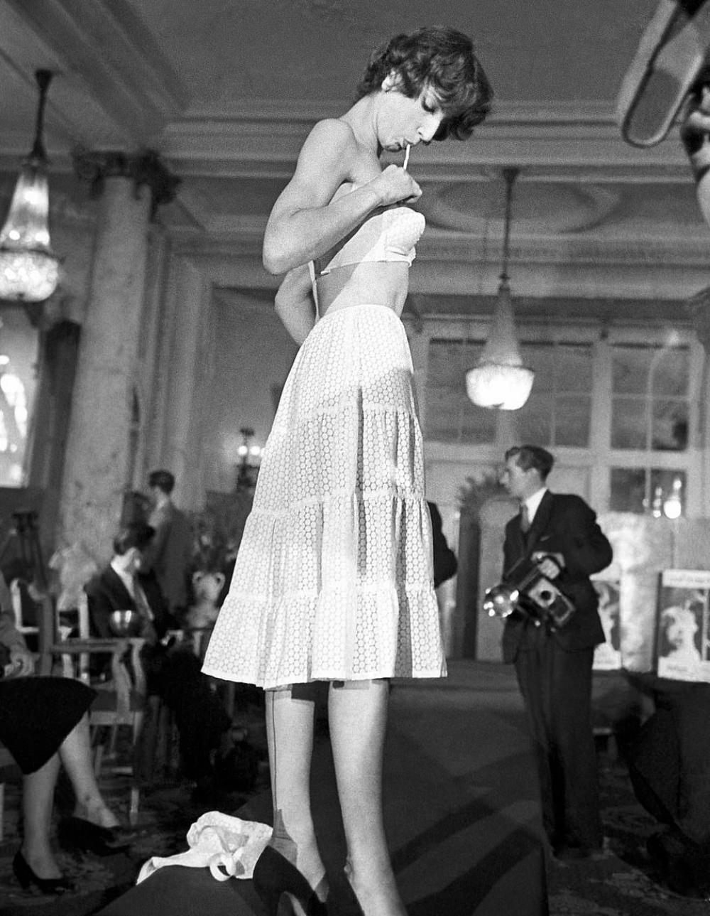 A model in 1952 takes to the stage to debut the bra, which is known as the Trés Secrete.