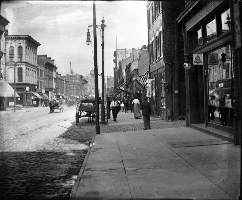 North 7th Street showing people at work and walking along street, 1904