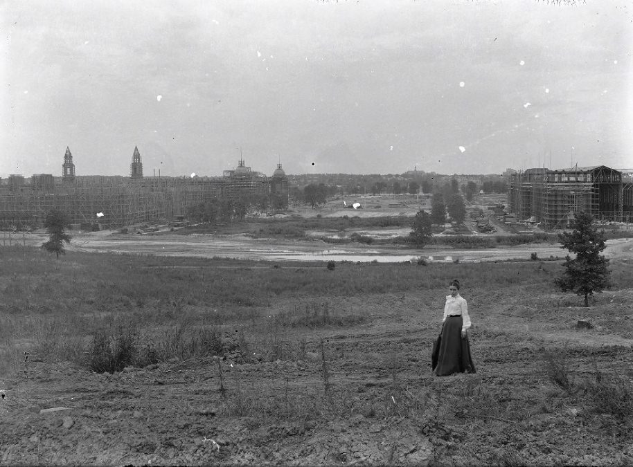 Woman Standing in Front of World Fair Construction, 1904