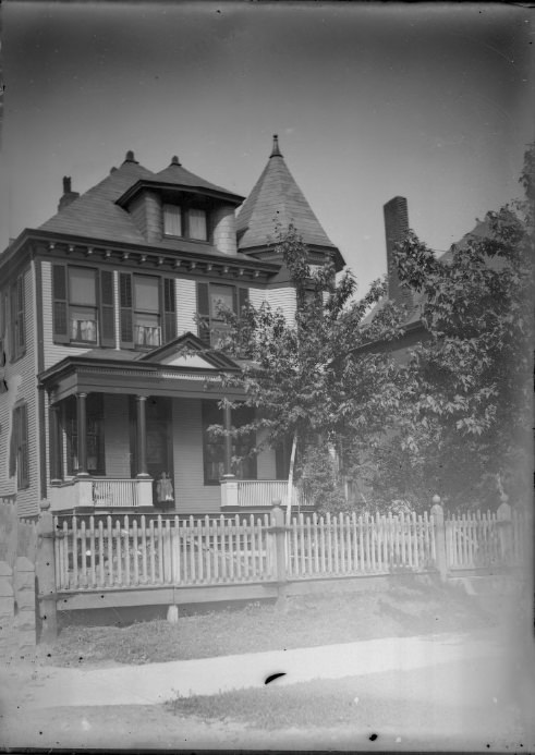 A Child Standing on the Porch of a Large House, 1901