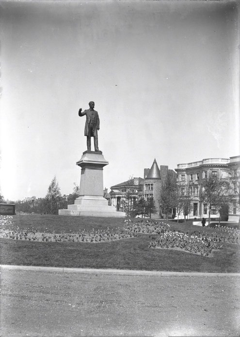 Statue of Francis P. Blair Jr. on a pedestal surrounded by tulip beds, 1904