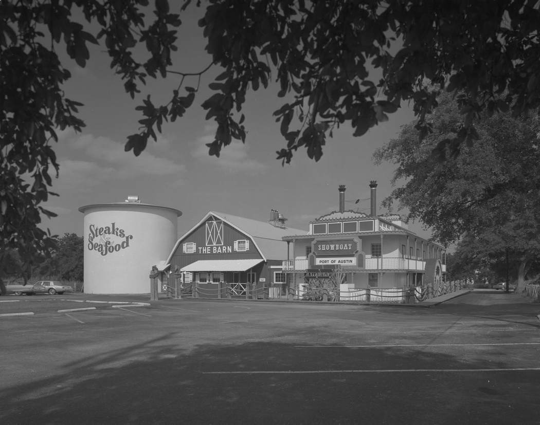 The exterior of a restaurant called "The Barn", located at 8611 Balcones Drive, 1977