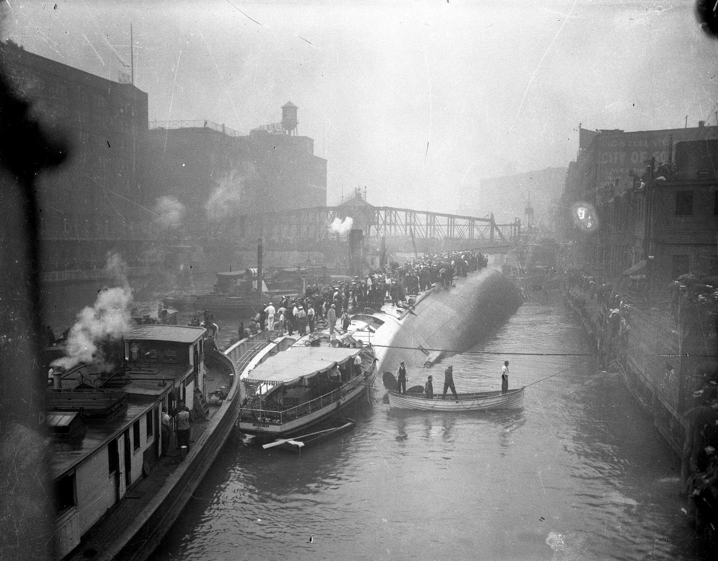 The S.S. Eastland lying on its side in the Chicago River after slowly rolling over and drowning 844 people on July 24, 1915 in Chicago.