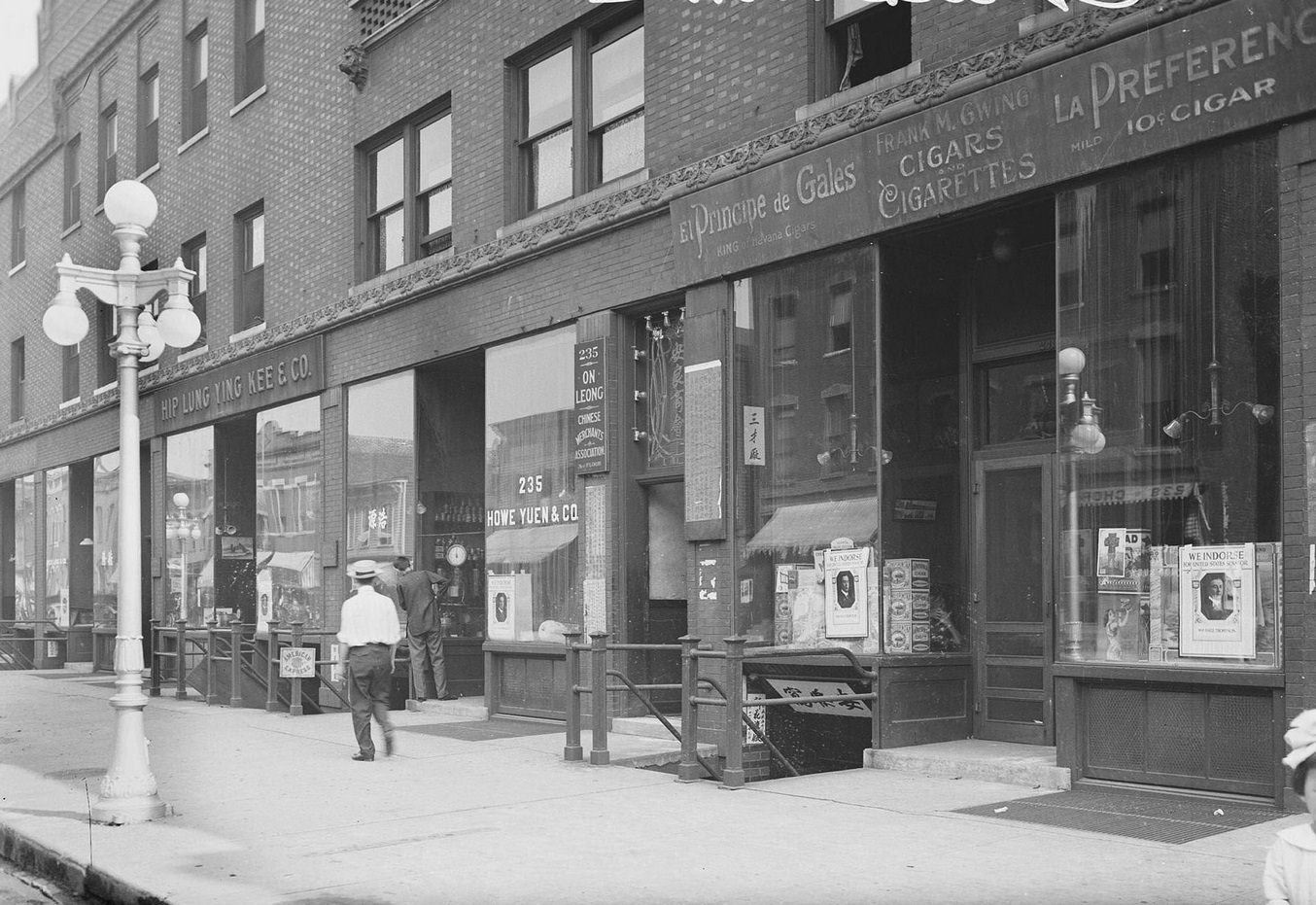 View of storefront in Chinatown, Hip Lung Yung Kee & Company, at 233 West 22nd Street in the Armour Square community area of Chicago, Illinois, 1910s.