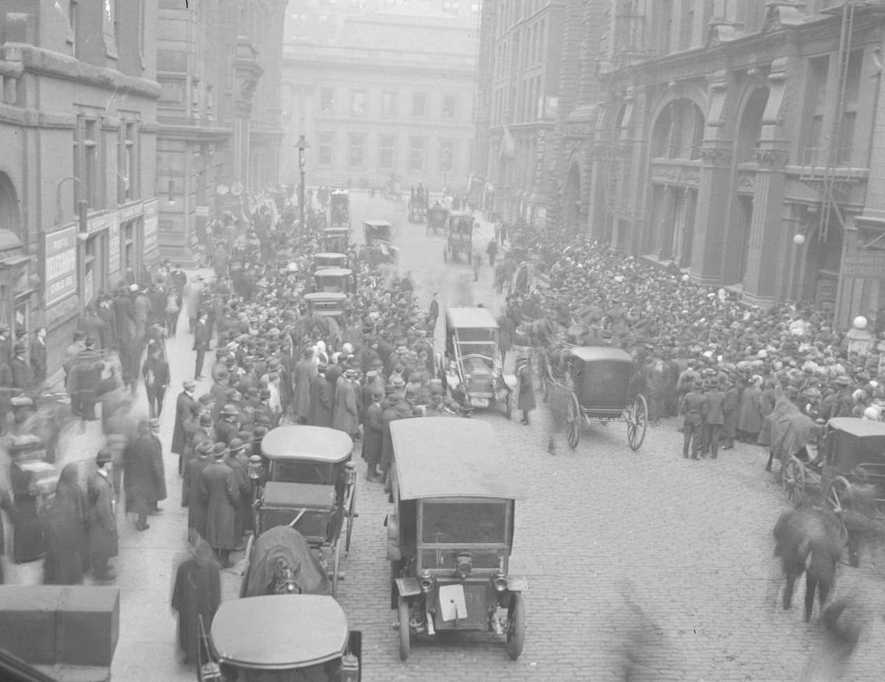 Crowd of people gathered for the garment workers' strike on Lasalle Street, north from Van Buren Street, Chicago, Illinois, 1910s.