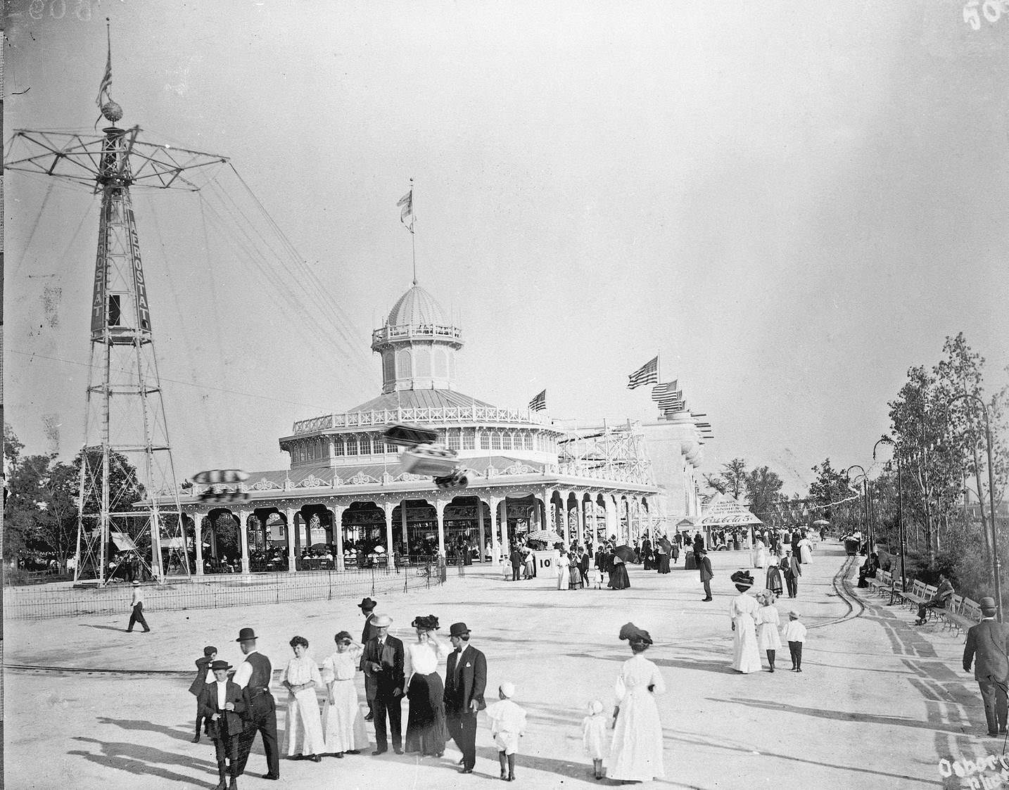 Scene at Riverview amusement park with carousel in background, Chicago, Illinois, 1910s.