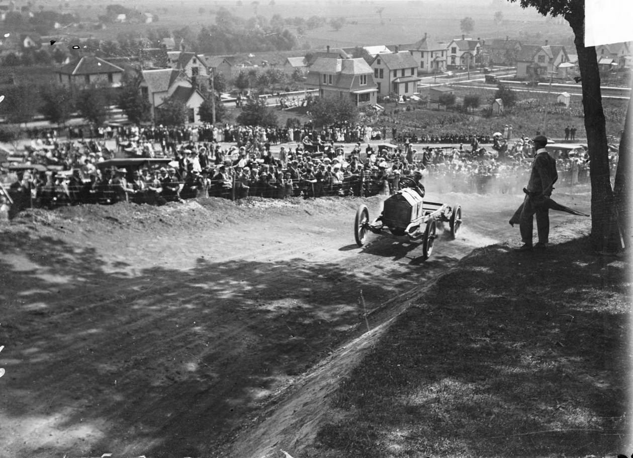 Automobile driver Moukmier (or possibly Moukmeer) driving a Staver automobile up a hill during the Algonquin Hill Climbing Contest, Chicago, Illinois, 1910s.