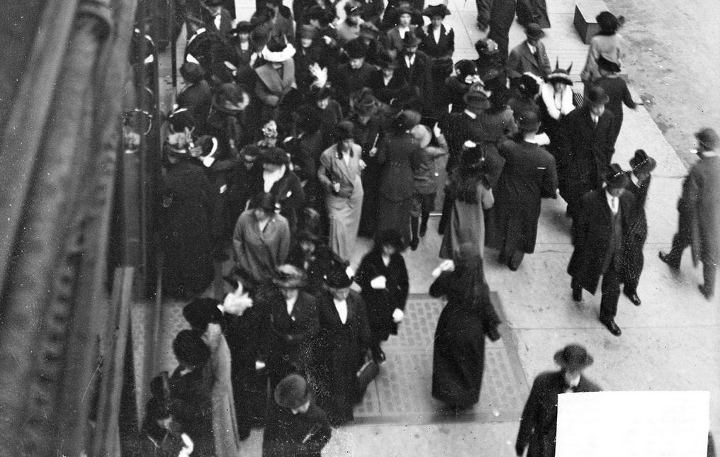 State Street in the Loop community area at Christmas, with sidewalk crowded with shoppers and street crowded with automobiles, horse drawn wagons, and streetcars, Chicago, Illinois, December 1, 1913.