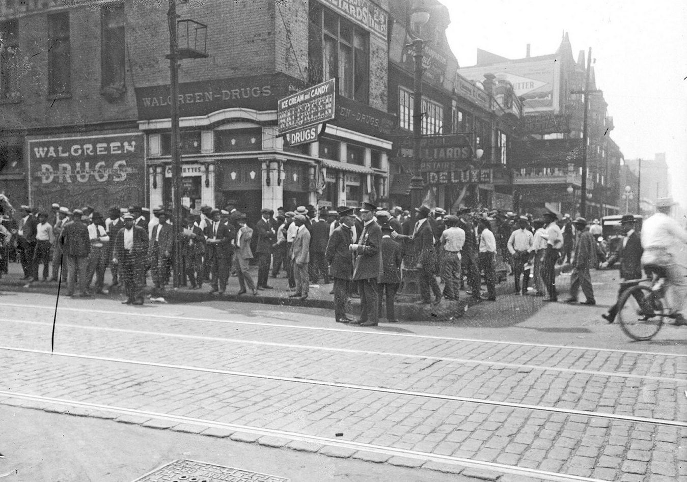Chicago race riot, African American men standing in front of Walgreen Drugs, 35th and State, Chicago, Illinois, July 30, 1919.