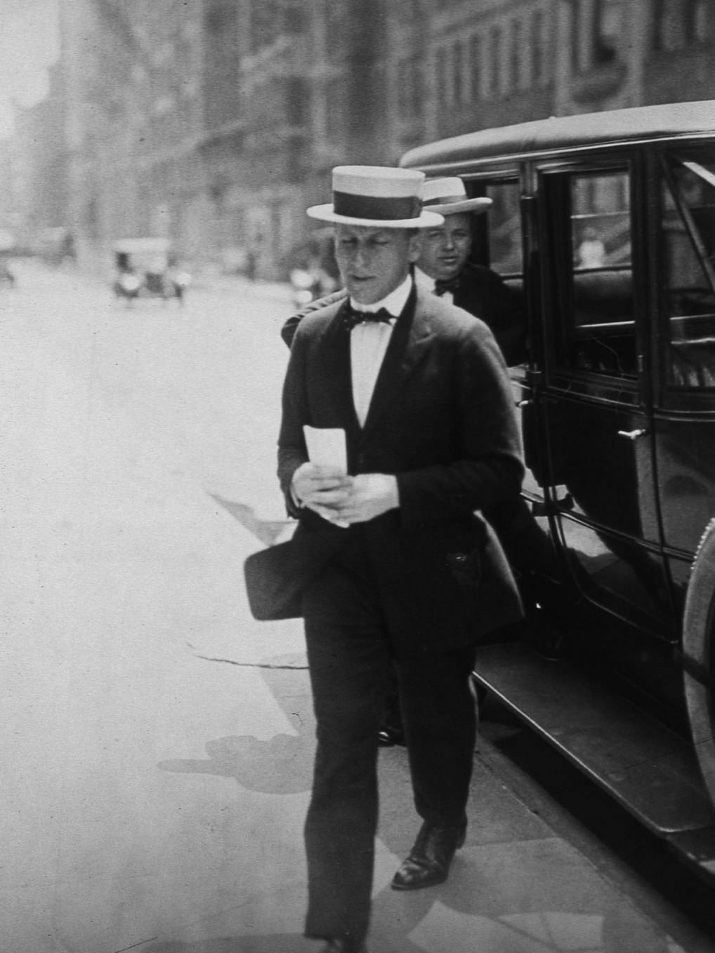 Arnold Rothstein, the gambler who set up the Black Sox scandal during the 1919 World Series in Chicago, is photographed exiting a car in Chicago, 1919.