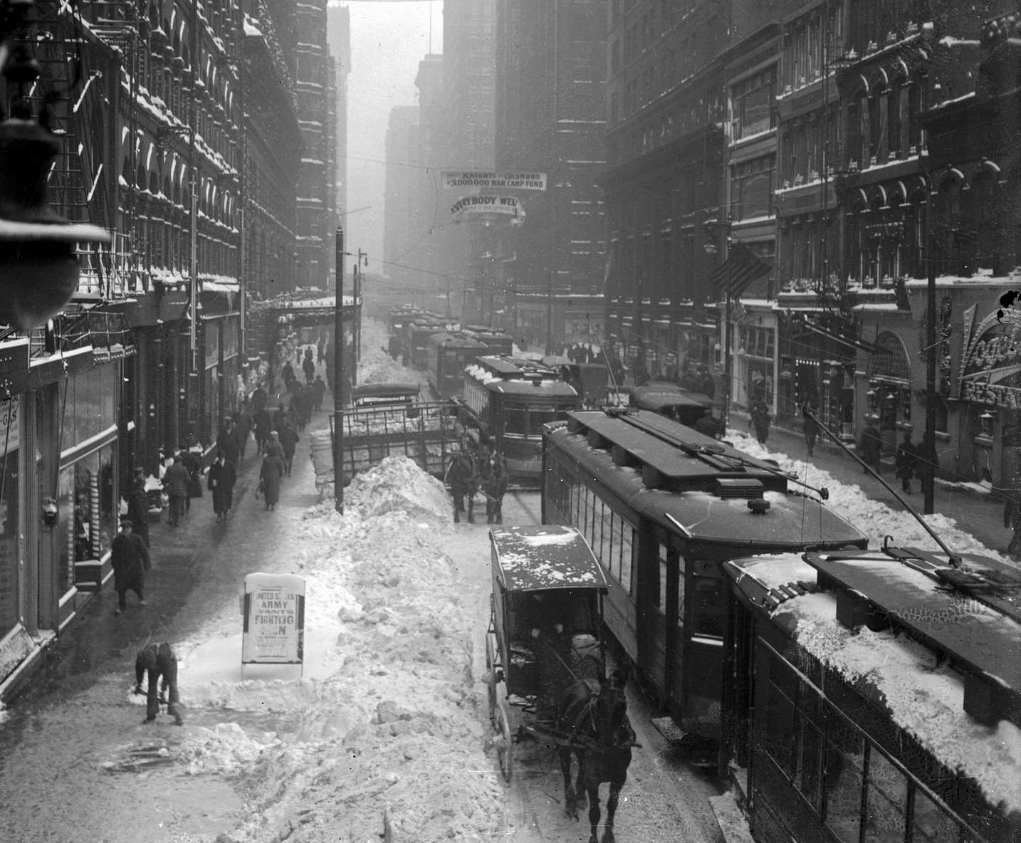 West Madison Street looking from North Wells Street, with Vogelsang's Restaurant at 173-181 West Madison visible on the extreme right, during a snowstorm in the Loop community, Chicago, Illinois, 1918.