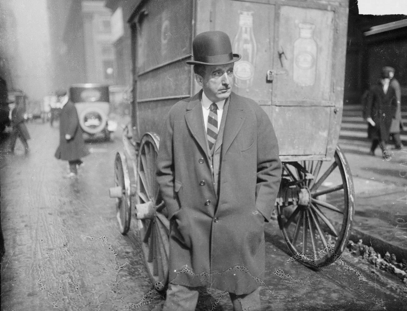 J. Ogden Armour, of the meatpacking industry and treasurer of the Illinois State Council of Defense, walking across a street, Chicago, Illinois, 1918.