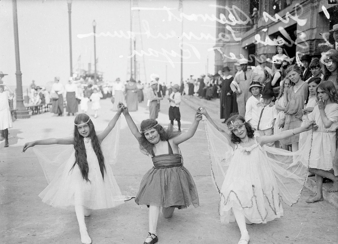 Elsie Tannenbaum, Iris Stewart and Harriet Ryan, wearing costumes and posing for a children's play at Municipal Pier (Navy Pier), Chicago, Illinois, 1917.